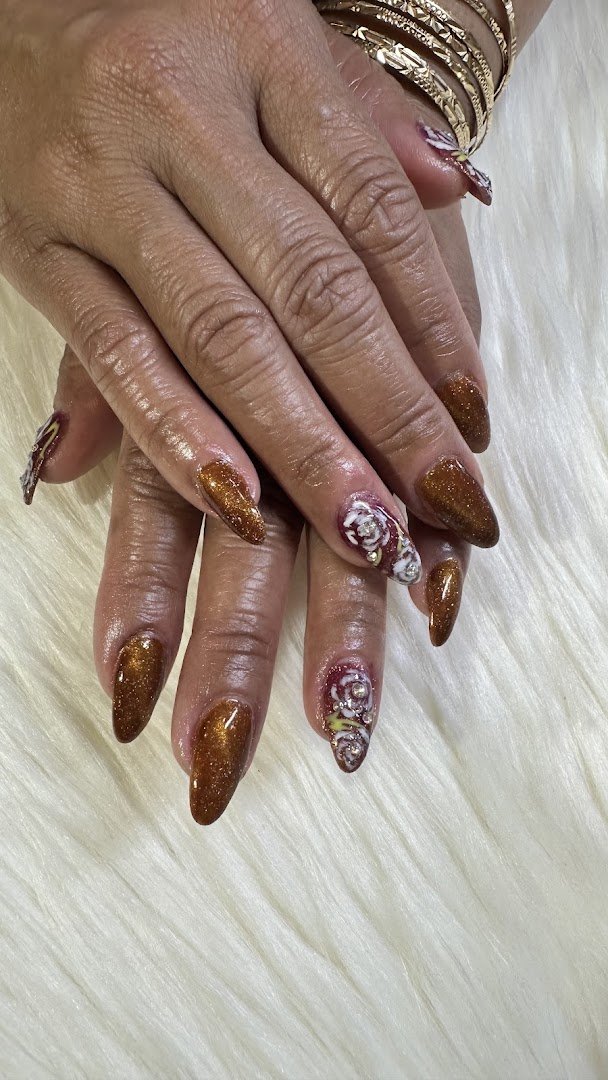 Nail technician painting polished acrylic nails