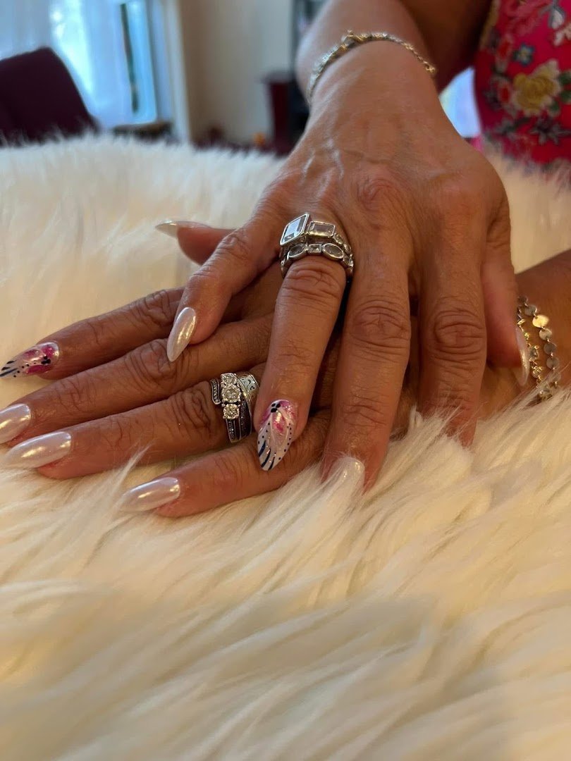 Rows of nail colors beside manicure tools